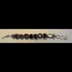 High quality sterling silver charm bracelet with genuine gemstones.